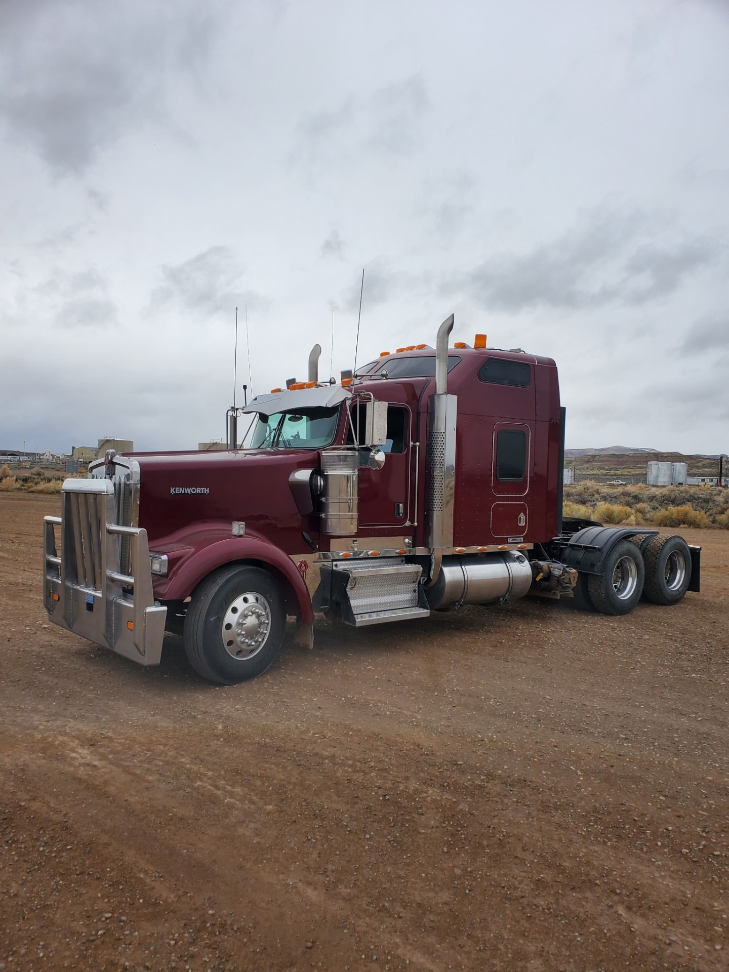 Buck's Trucks maroon Kenworth semi tractor on a Wyoming production location
